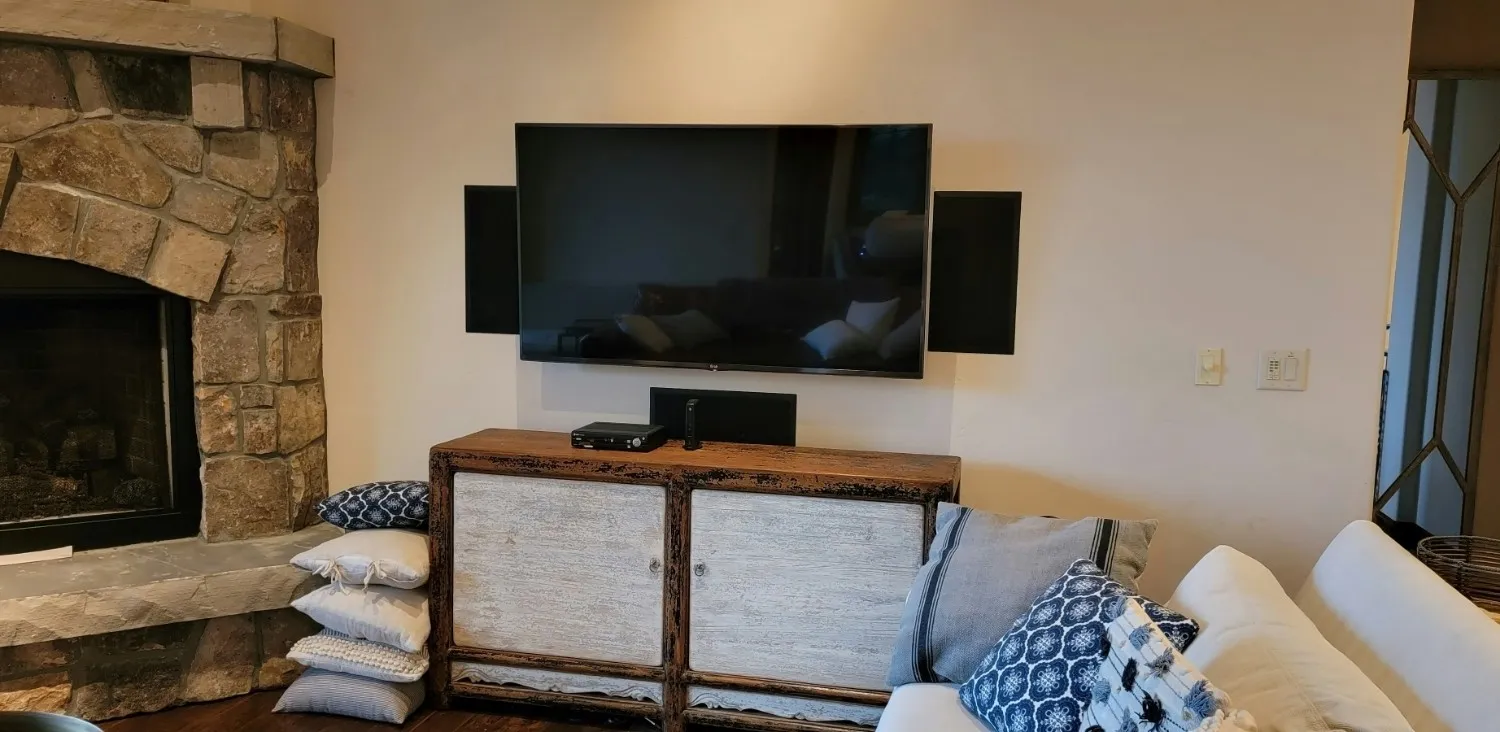 TV mounted and installed with speakers